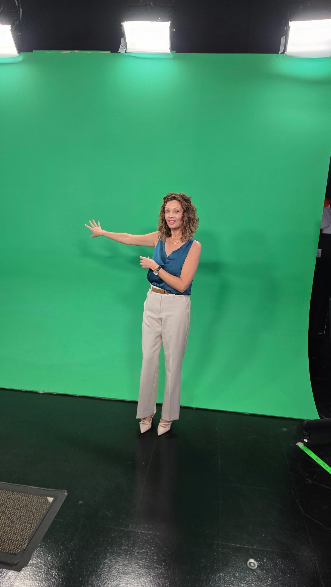 Founder directing to camera on a professional green-screen set.