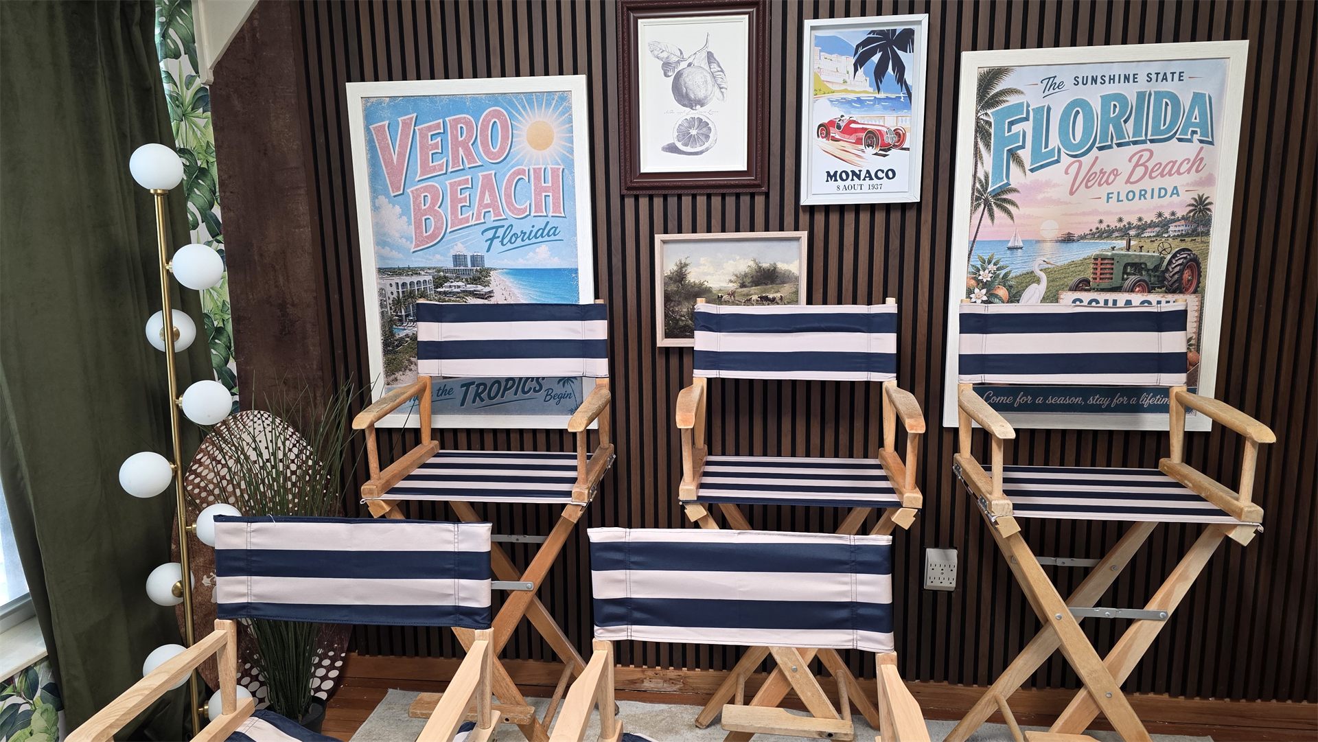 Director's chairs and vintage travel posters on the Executive Content Studio set.