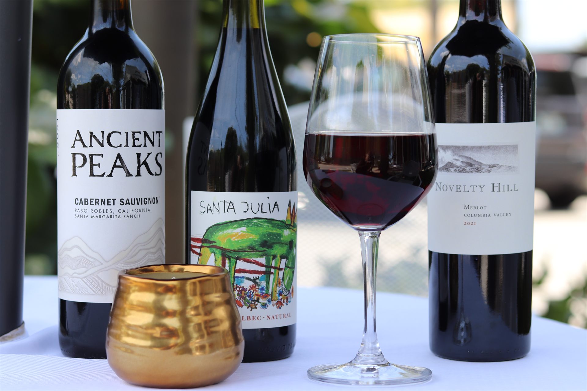 Custom brand photography for Vero Wine Bar — red wine flight styled on a linen table.